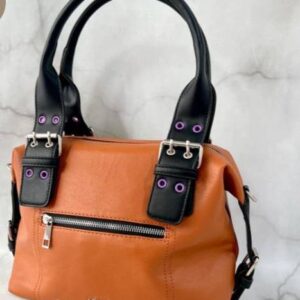 CARTERA RÍGIDA JOUP CON HEBILLA EN LAS AZAS